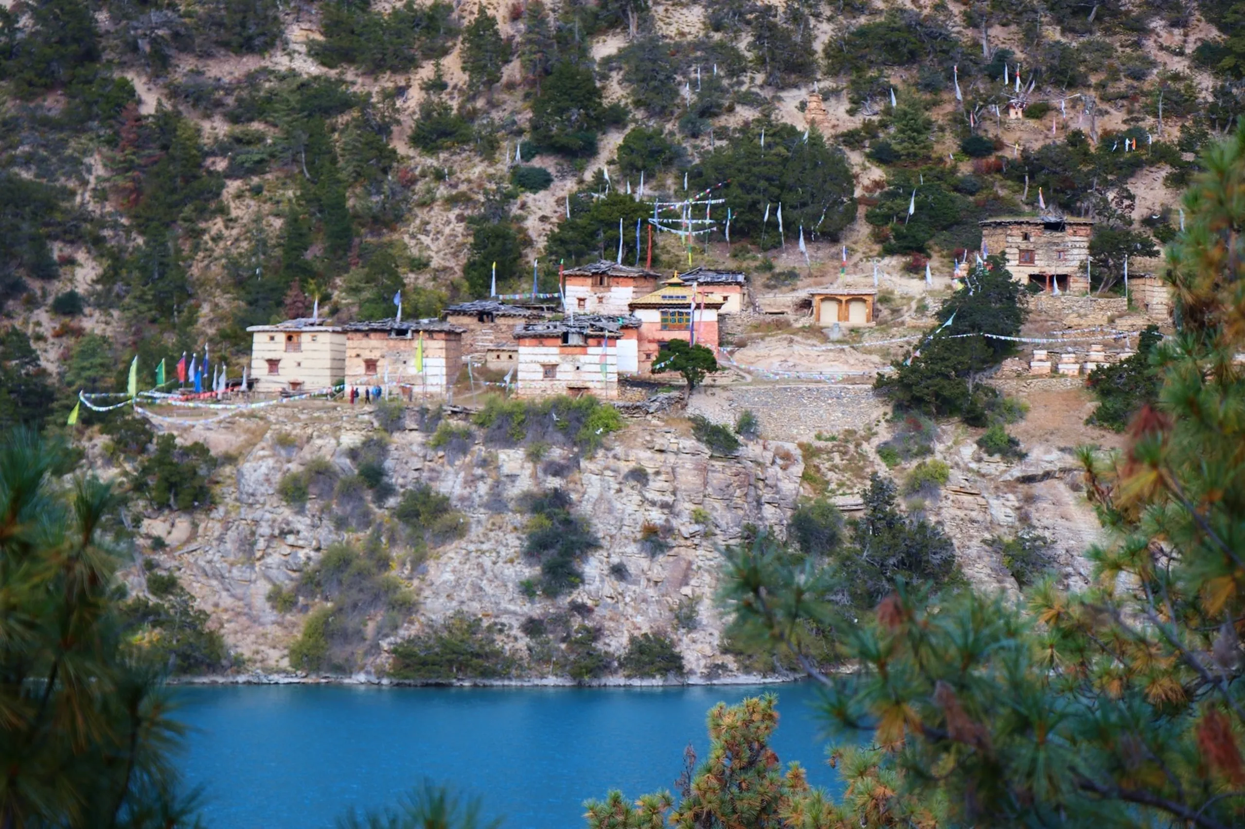 Some places are beautiful. Shey Phoksundo is something else entirely. Every viewpoint revealed a new masterpiece.

Monasteries rested quietly above the water, autumn colors painted the hillsides, and from high above the lake glowed like a hidden jewel inside the Himalayas. No camera, drone, or filter truly captures the feeling of standing there. You simply have to experience it yourself.
