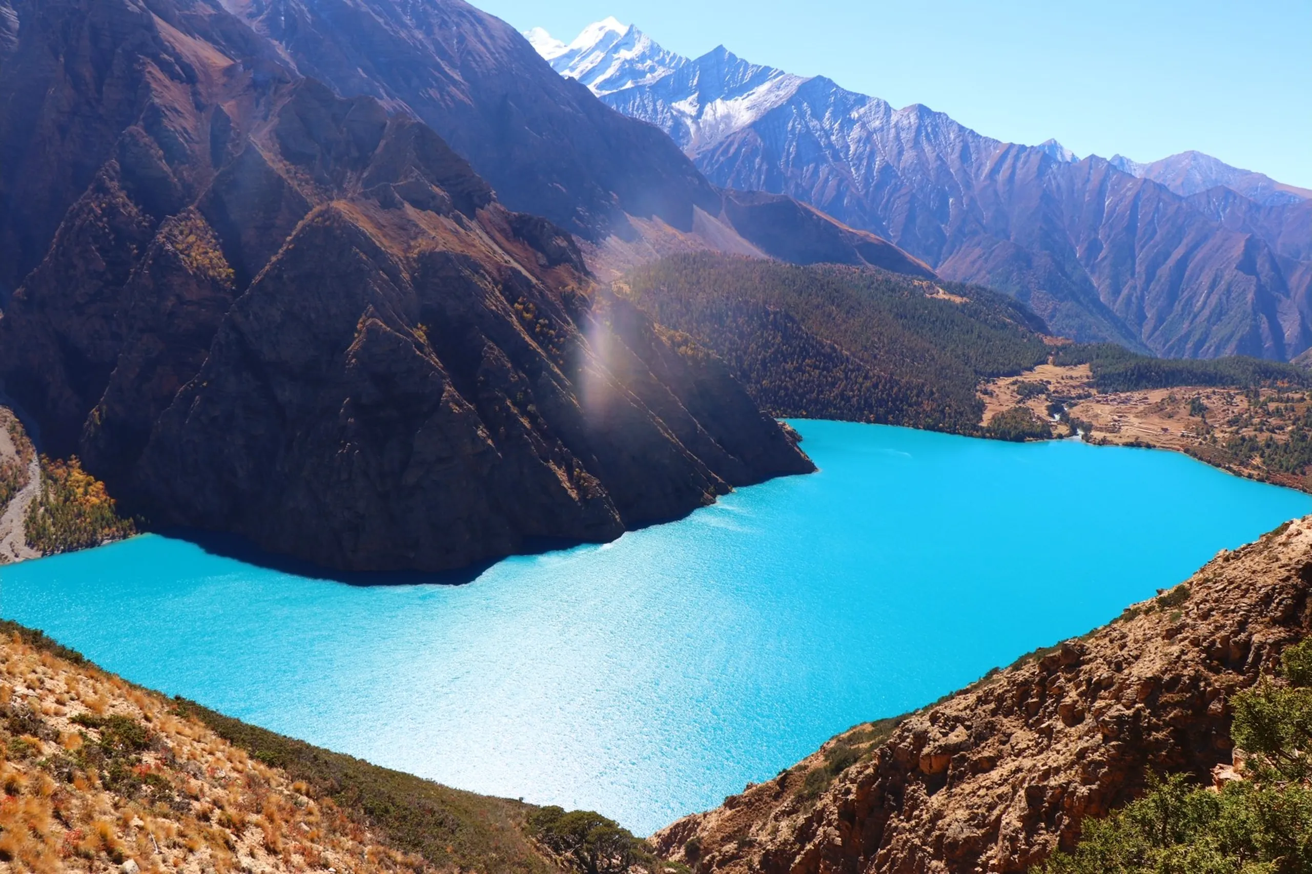 Some places are beautiful. Shey Phoksundo is something else entirely. Every viewpoint revealed a new masterpiece.

Monasteries rested quietly above the water, autumn colors painted the hillsides, and from high above the lake glowed like a hidden jewel inside the Himalayas. No camera, drone, or filter truly captures the feeling of standing there. You simply have to experience it yourself.